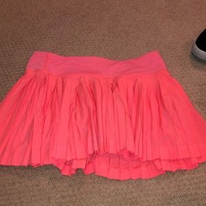 Neon pink/coral pleated tennis skirt